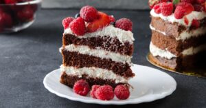 Homemade Chocolate Naked Cake with Cream and Raspberries