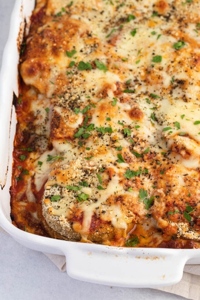 Homemade Eggplant Parmesan in a White Casserole