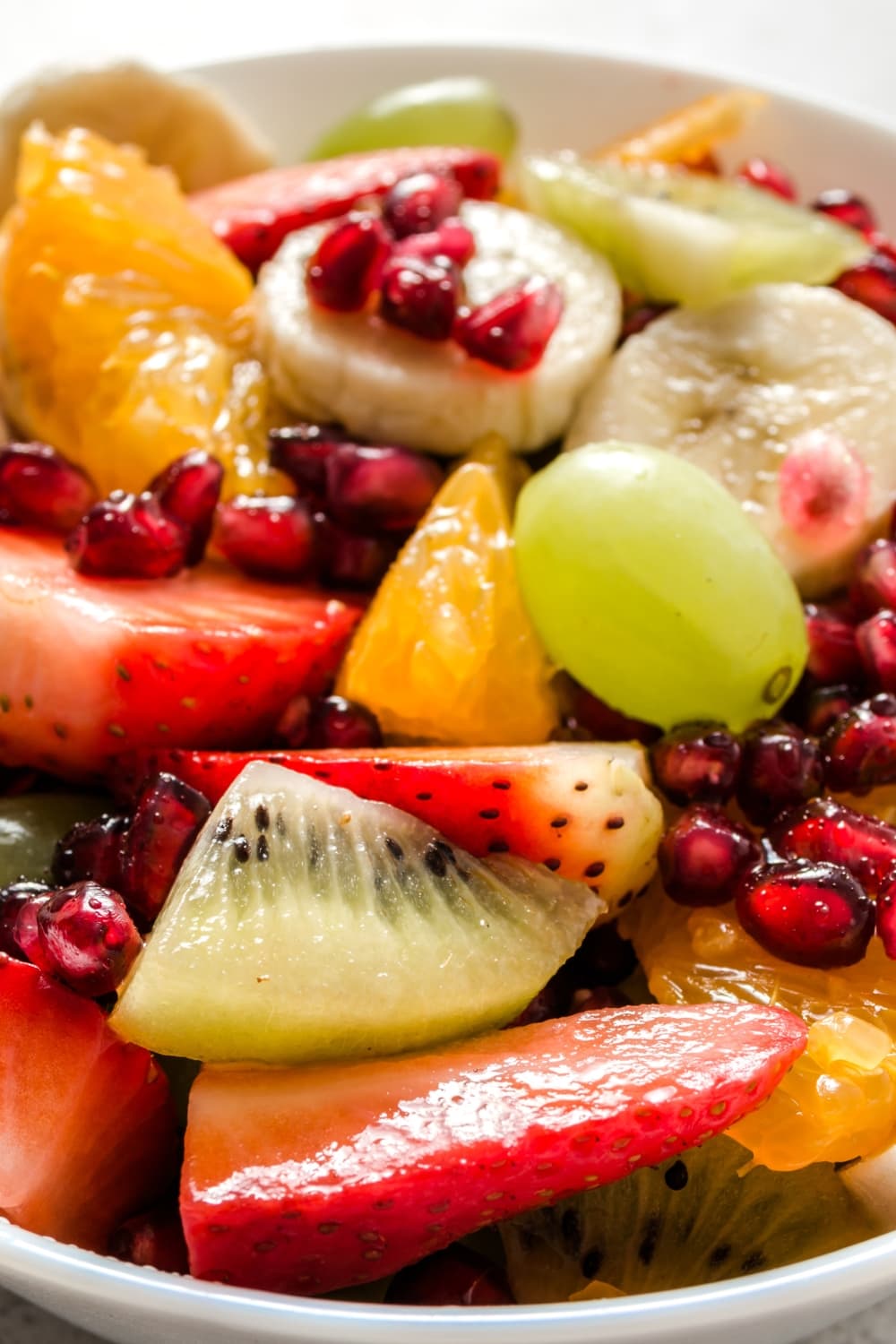 Homemade Fruit Salad with Kiwi, Orange, Pomegranate and Grapes