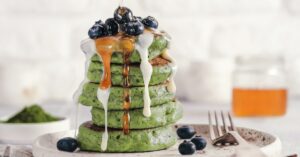 Homemade Green Pancake with Blueberries with Peanut Butter and Honey