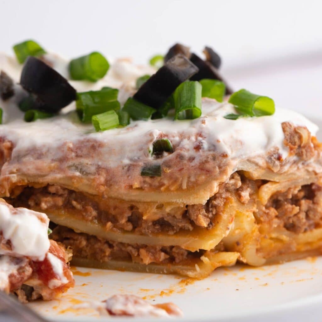 Homemade Mexican Lasagna with Ground Beef and Refried Beans