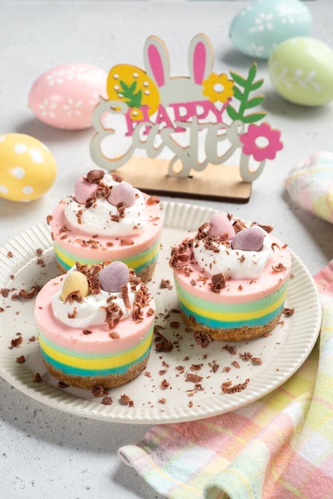Leftover Easter Egg Recipes featuring Homemade Mini Cheesecakes with Candy Eggs and Whipped Cream