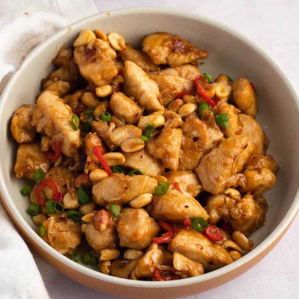 Homemade Princess Chicken in a Bowl with Nuts and Spices