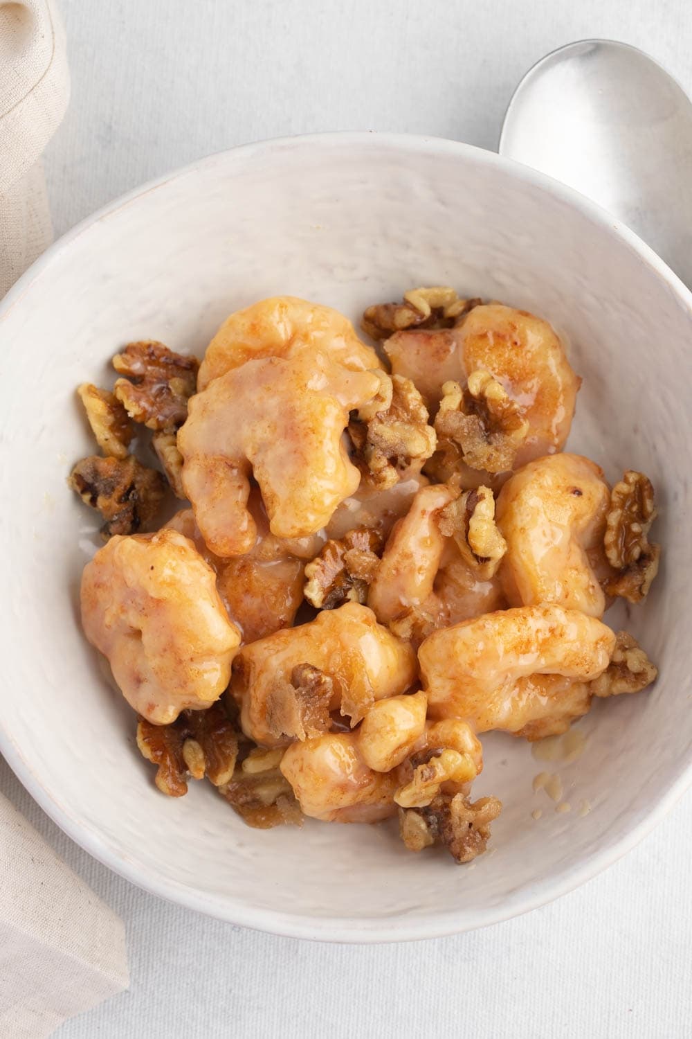 Top View of a Bowl With Honey Walnut Shrimp with Sweet and Creamy Sauce 