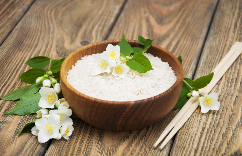 Jasmine Rice with Jasmine Flowers in a Brown Bowl