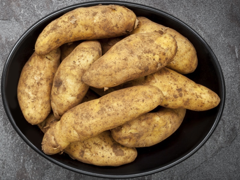 Bunch of Kipfler Potatoes in a Black Metal Dish