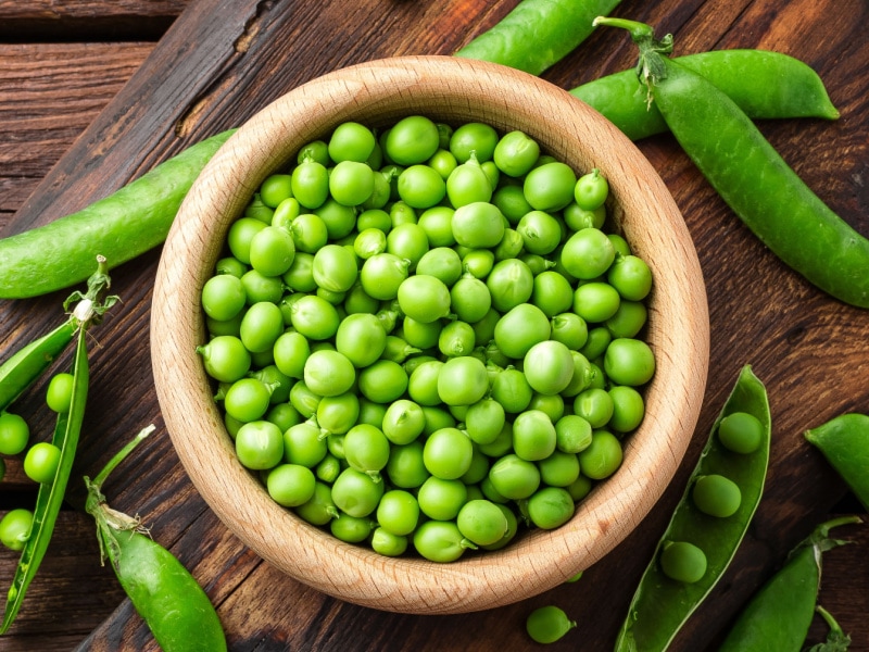 Fresh Peas in a Wooden Bowl