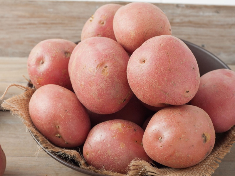 Bunch of Red Potatoes in a Wooden Bowl