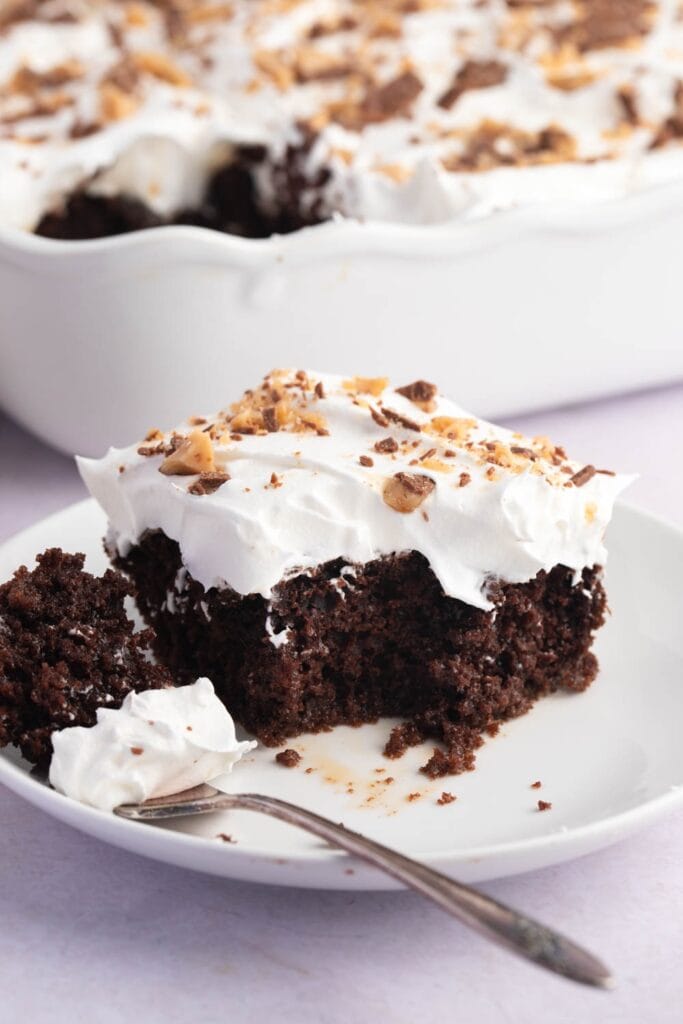 Better Than Sex Cake - Fluffy whipped cream on top with bits of chocolate-covered toffee