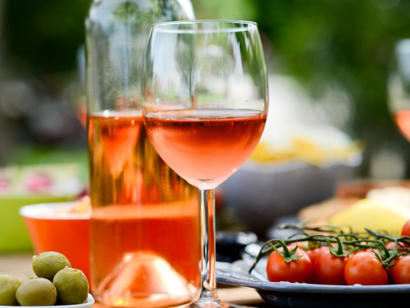A Bottle and A Glass of Rosé Wine