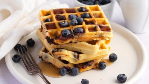 Stacked Homemade Blueberry Waffles with Honey