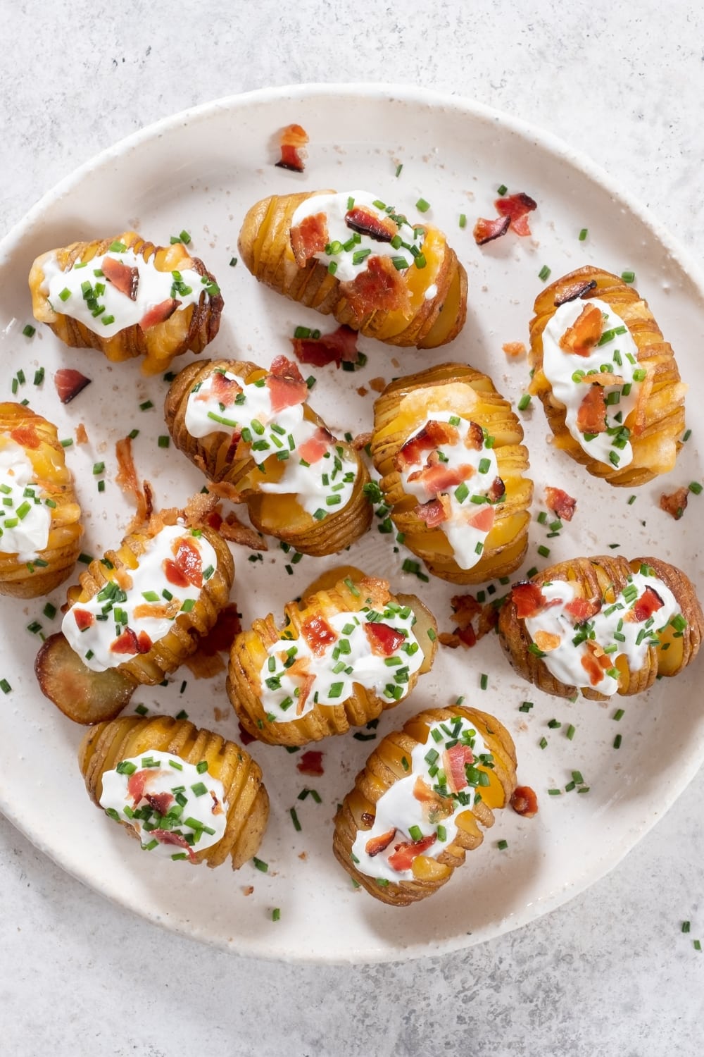 Loaded Hasselback potatoes with bacon and sour cream.