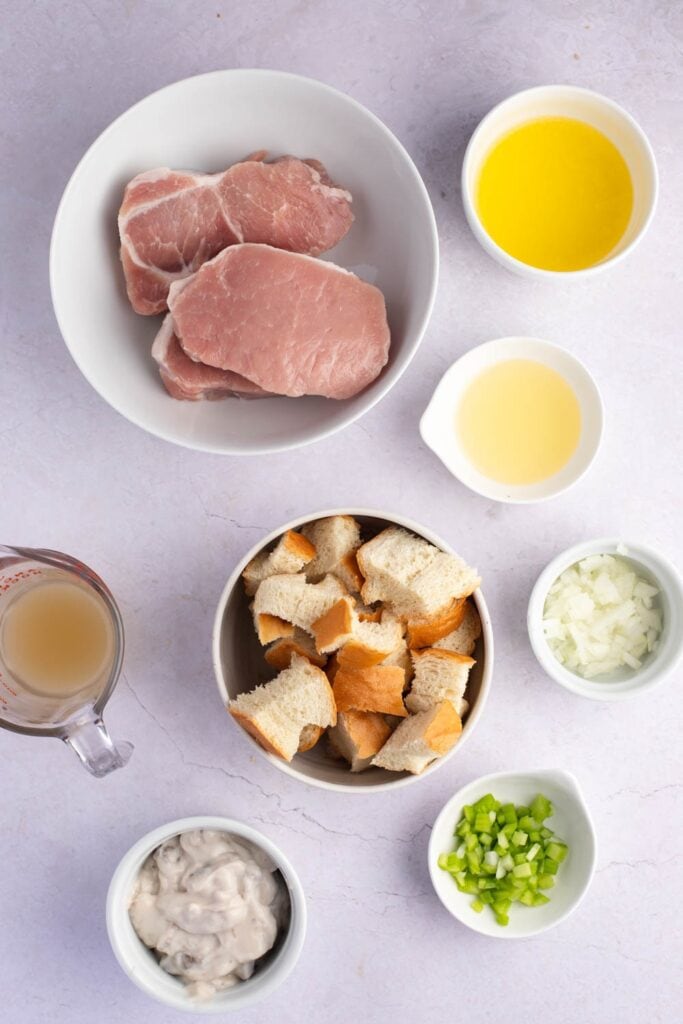 Stuffed Pork Chop Ingredients - Pork Chops, Day Old Bread Cubes, Butter, Chicken, Broth, Celery, Onion, Poultry Seasoning, Condensed Cream of Mushroom Soup