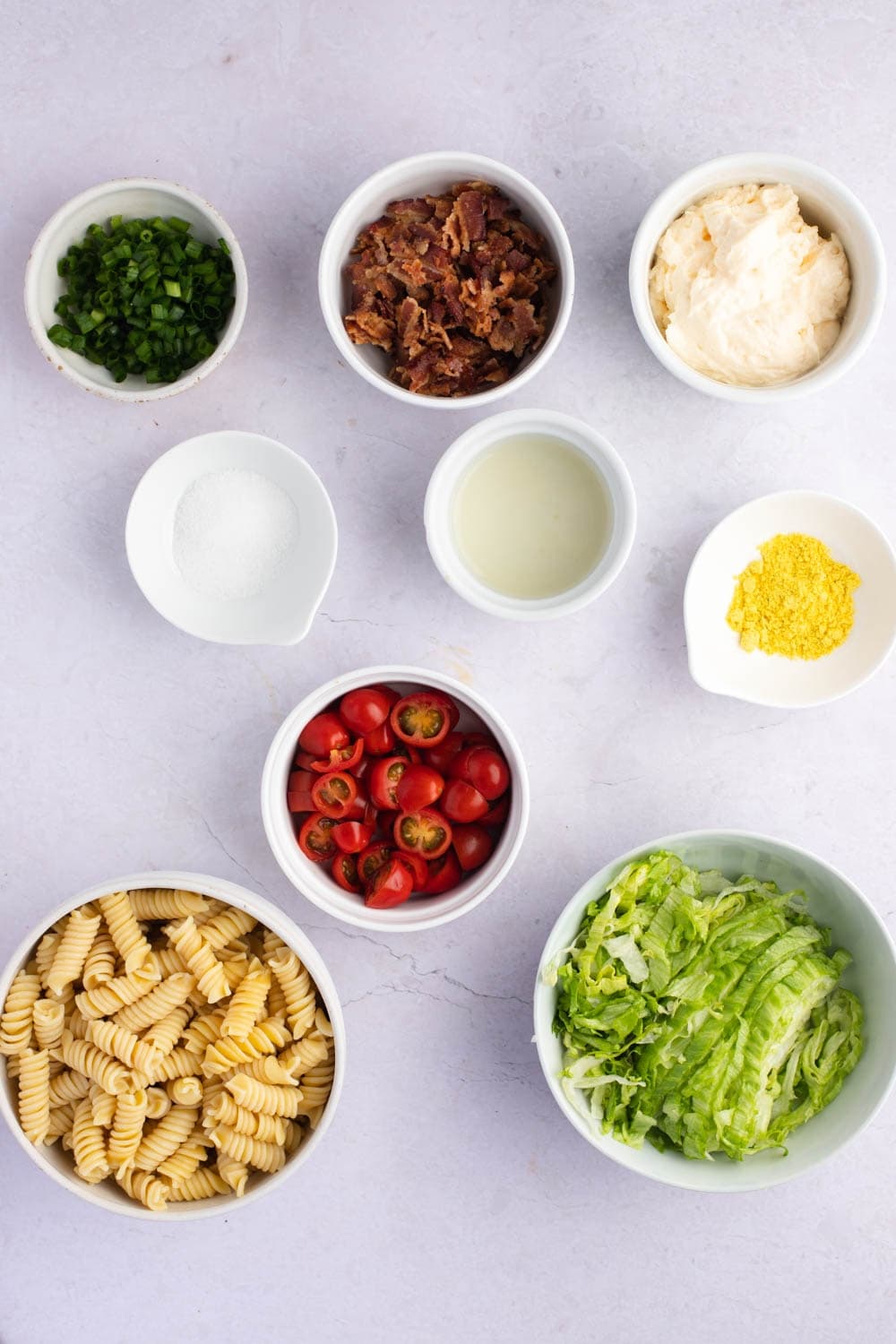 BLT Pasta Salad Ingredients: Mayonnaise, Lemon, Juice, Sugar, Chicken, Flavored Bouillon, Pasta, Bacon, Tomato, Green Onions and Lettuce