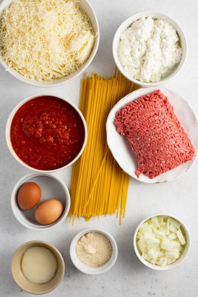 Baked-Spaghetti-Ingredients-Spaghetti-Ground-Beef-Chopped-Onions-Spaghetti-Sauce-Salt-Eggs-Cheese-and-Nutter