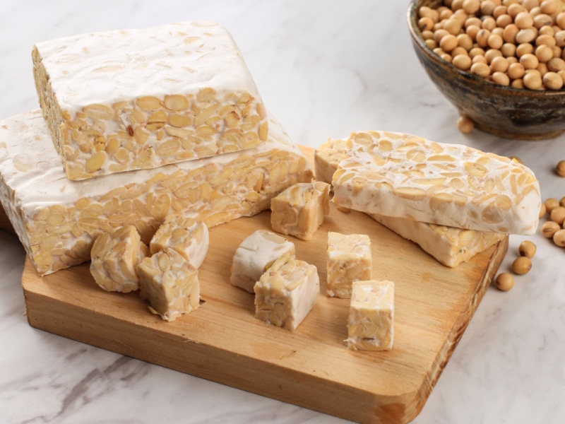 Blocks of Tempeh on a Wooden Chopping Board