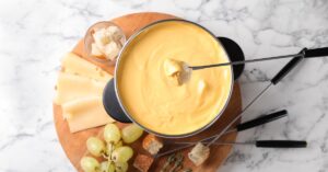Cheese Fondue Dip with Fresh Grapes and Bread