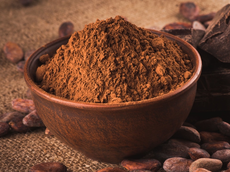 A Heap of Cocoa Powder on a Wooden Bowl