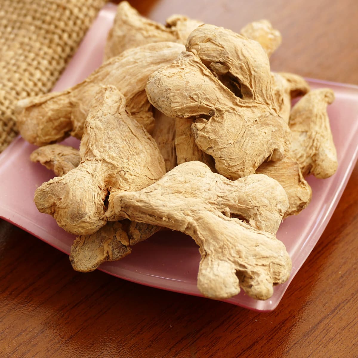 Whole Dried Ginger Roots on a Plate