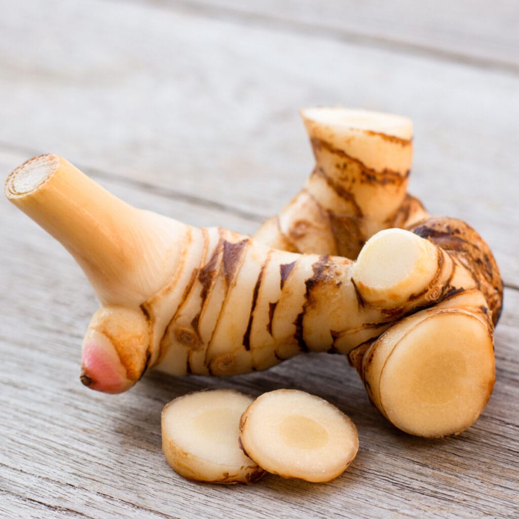 Fresh Galangal on a Wooden Table