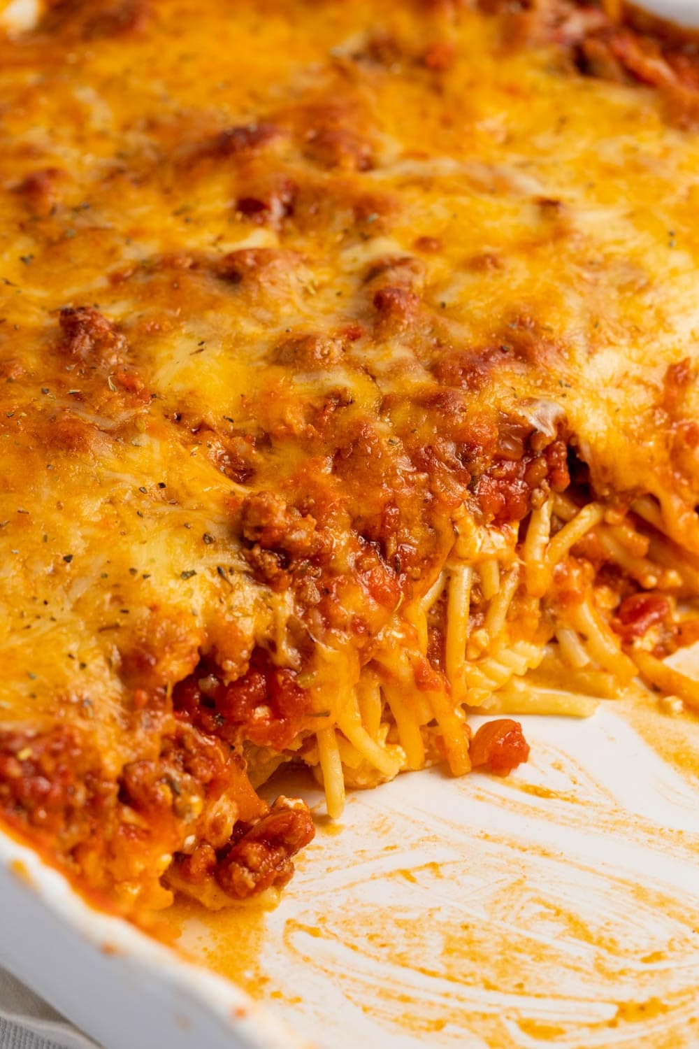 Closeup of Baked Spaghetti with Ground Beef and Melted Cheese on Top