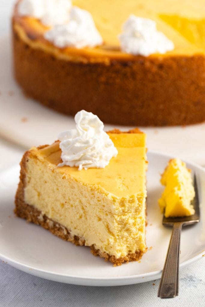 Lemon Cheesecake with Whipped Cream. Decadent, creamy, and slightly tangy.