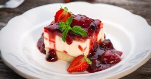 Homemade Sweet Strawberry Cheesecake on a White Plate