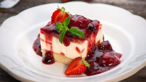 Homemade Sweet Strawberry Cheesecake on a White Plate