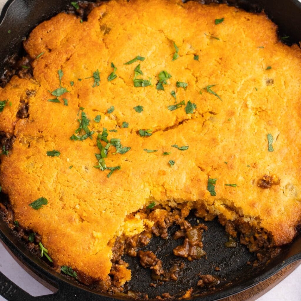 Tamale Pie Ingredients - Ground Beef, Enchilada Sauce, Chili Powder, Cheddar Cheese and Corn Muffin Mix
