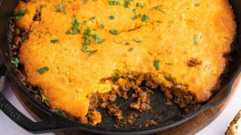 Homemade Tamale Pie with Ground Beef in a Black Skillet