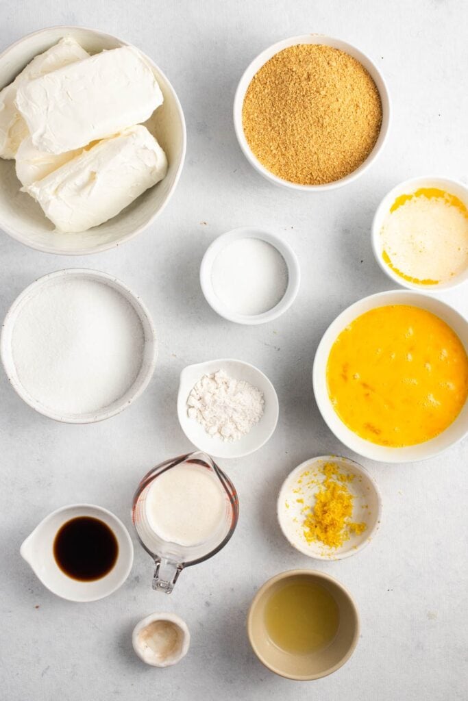 Lemon Cheesecake Ingredients - Graham Crackers, Butter, Sugar, Cream Cheese, Lemon Juice, Flour and Eggs