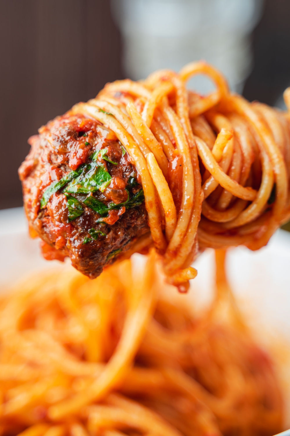 Meatball on a Fork with Saucy Spaghetti Twirling Around the Fork