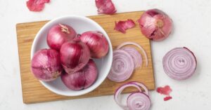 Raw Organic Purple Shallots in a White Bowl