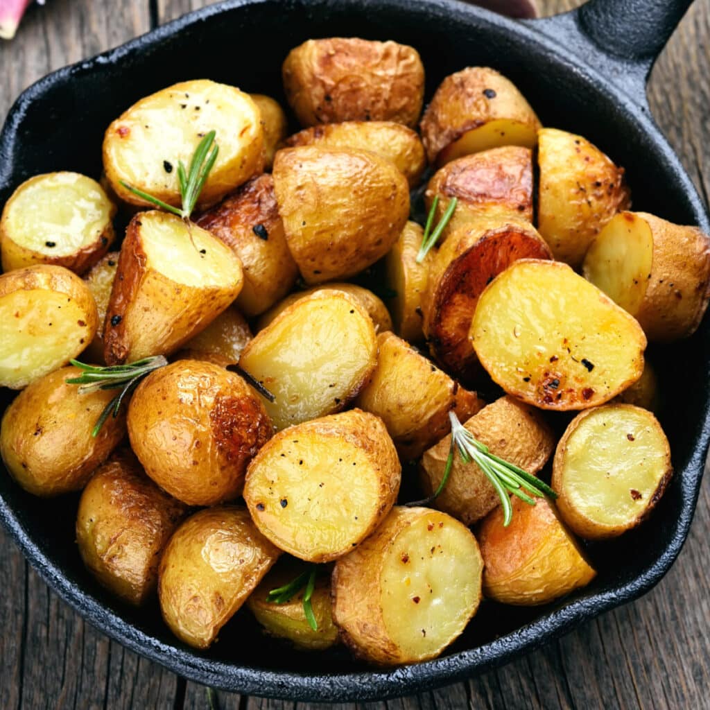 Rosemary Roasted Potatoes Garnished with Fresh Leaves