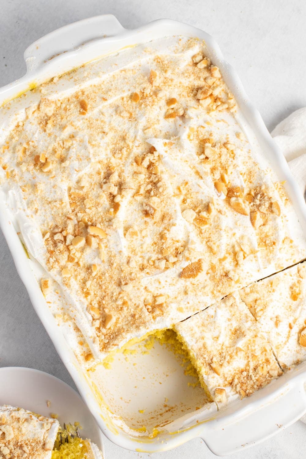 Banana Pudding Poke Cake in a white baking dish (Overhead view)