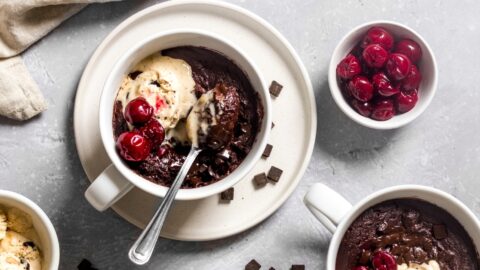 Sweet Homemade Chocolate Brownie in a Mug with Cherries