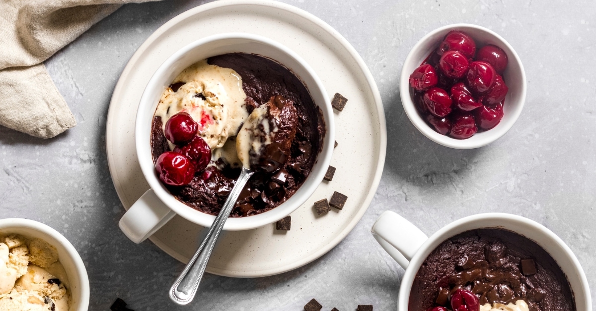 Sweet Homemade Chocolate Brownie in a Mug with Cherries
