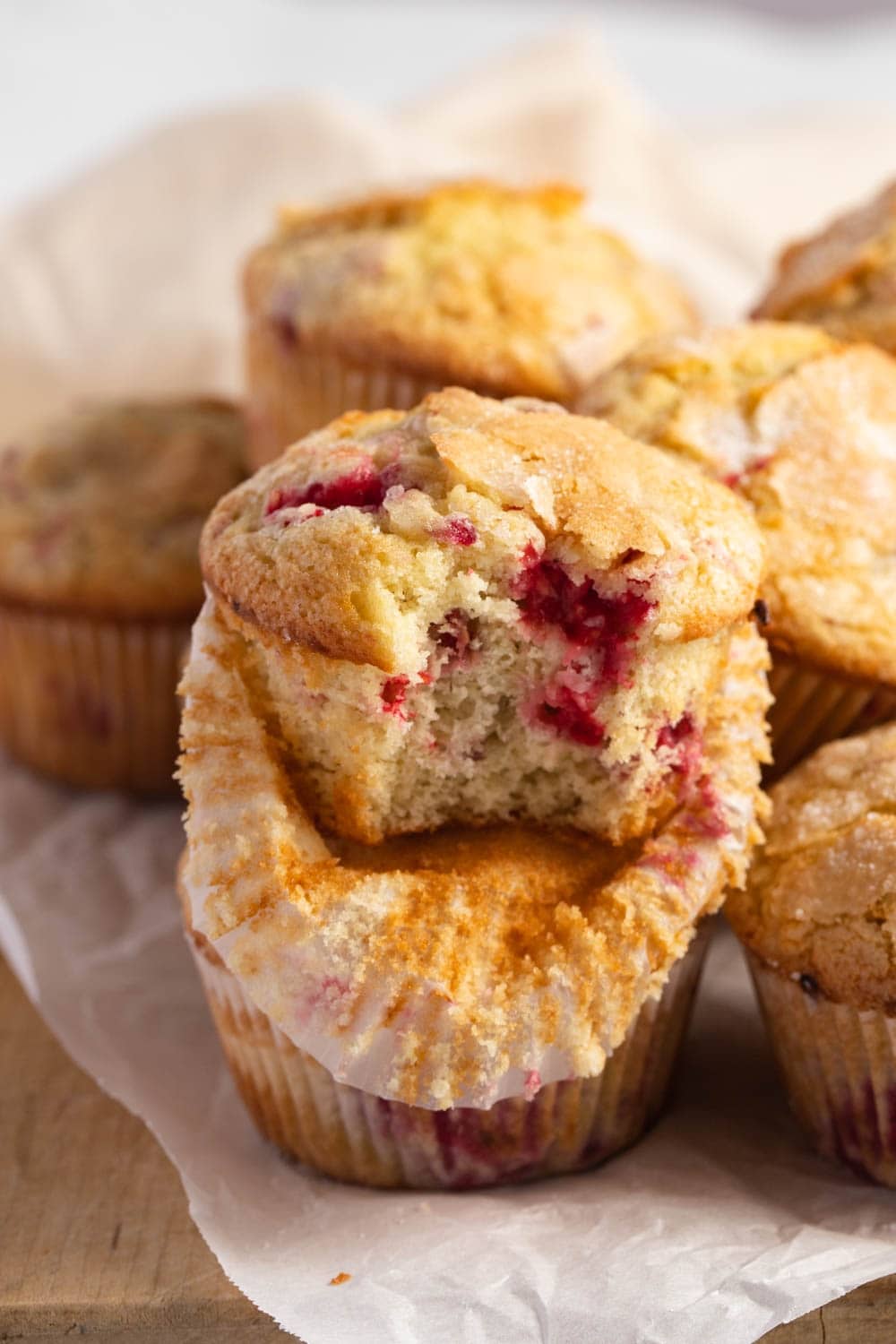 Bunch of muffins with raspberry speckles. 