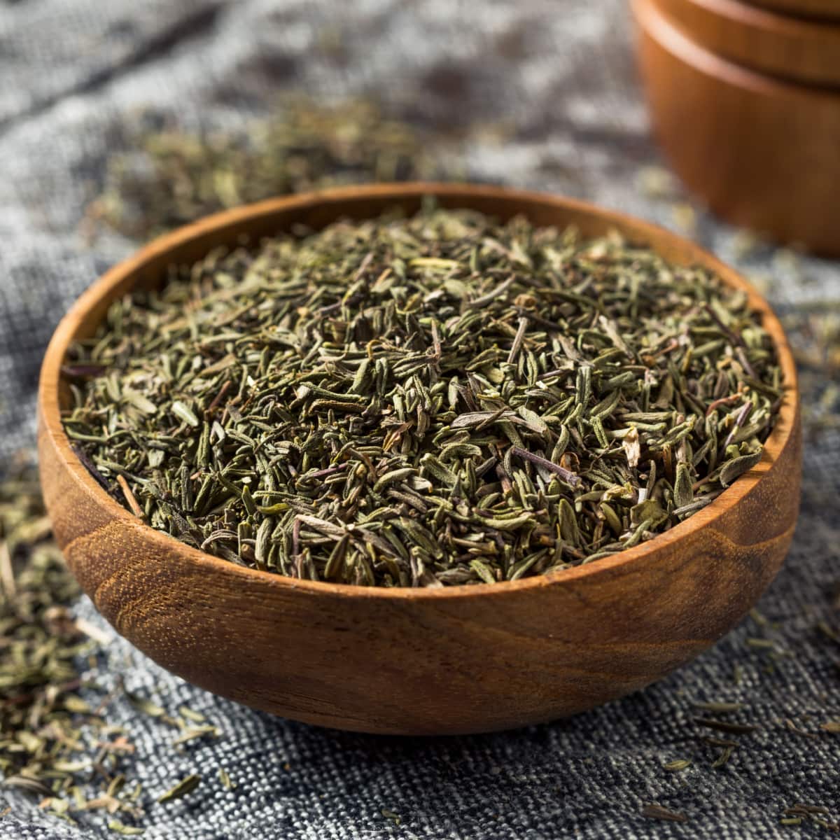 Dried Organic Thyme on a Wooden Bowl
