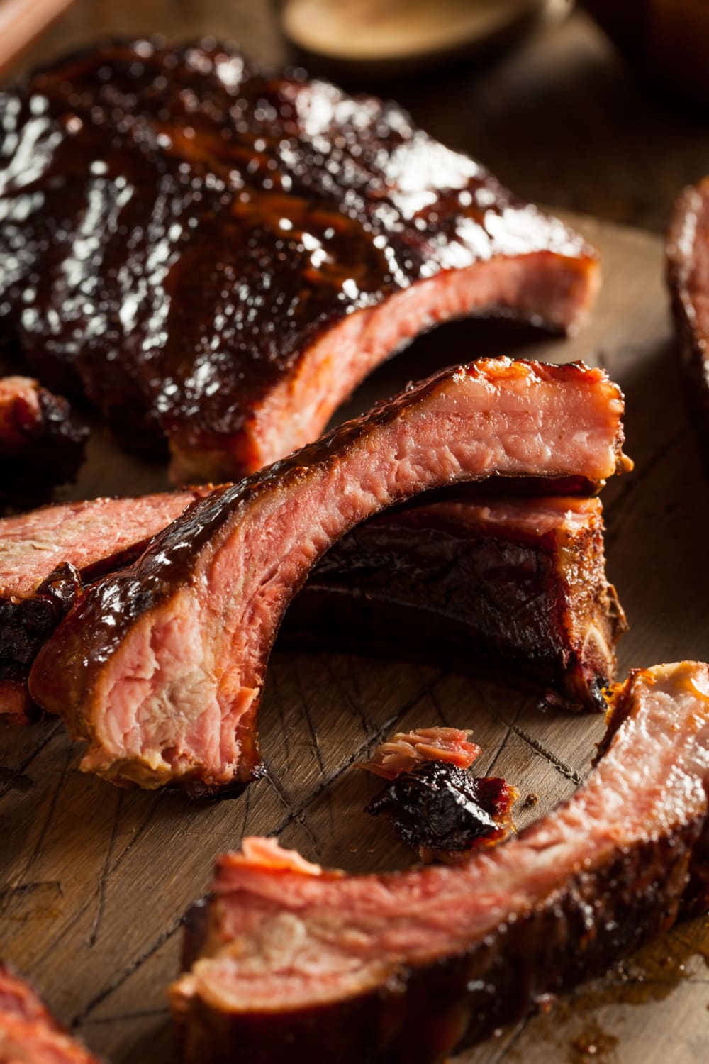 Sliced Oven Baked Baby Back Ribs on Wooden Cutting Board