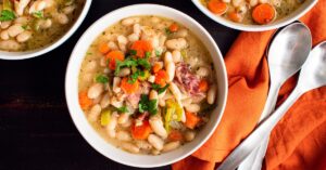 Bowl of Homemade Bean and Ham Soup with Carrots