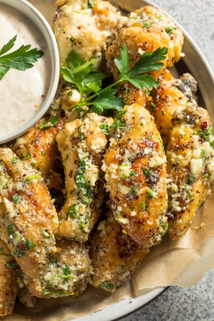 Closeup of Mouthwatering Chicken Wings With Garlic Parmesan Sauce