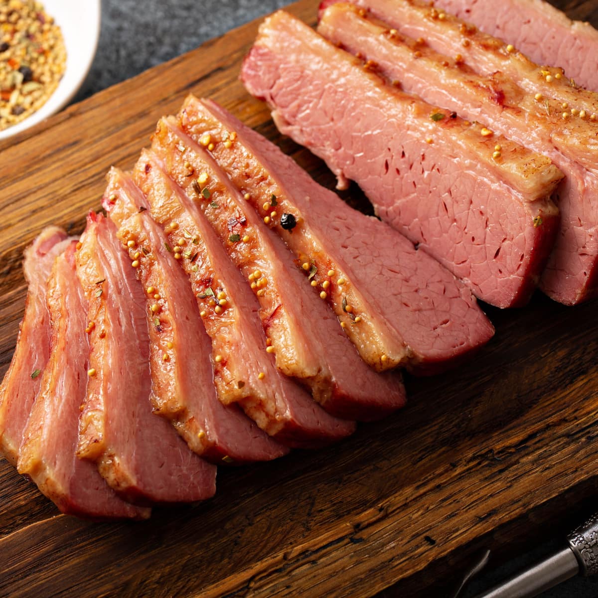 Slices of Corned Beef on a Wooden Cutting Board