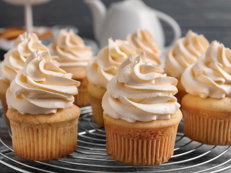 Cupcakes Topped With Butter Cream on a Cooling Rack