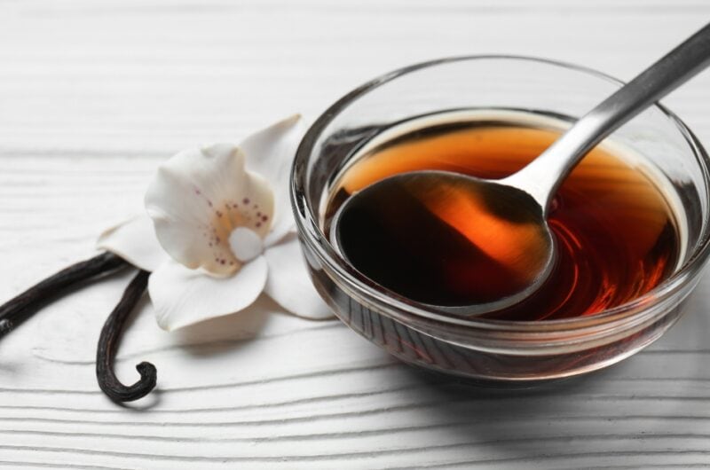 Glass Bowl of Vanilla on a White Wooden Table