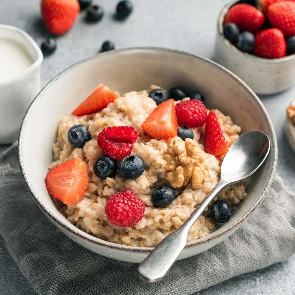 Healthy Oatmeal Porridge with Strawberries and Blueberries