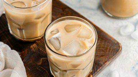 Two glasses of homemade Irish cream with ice, hero shot.