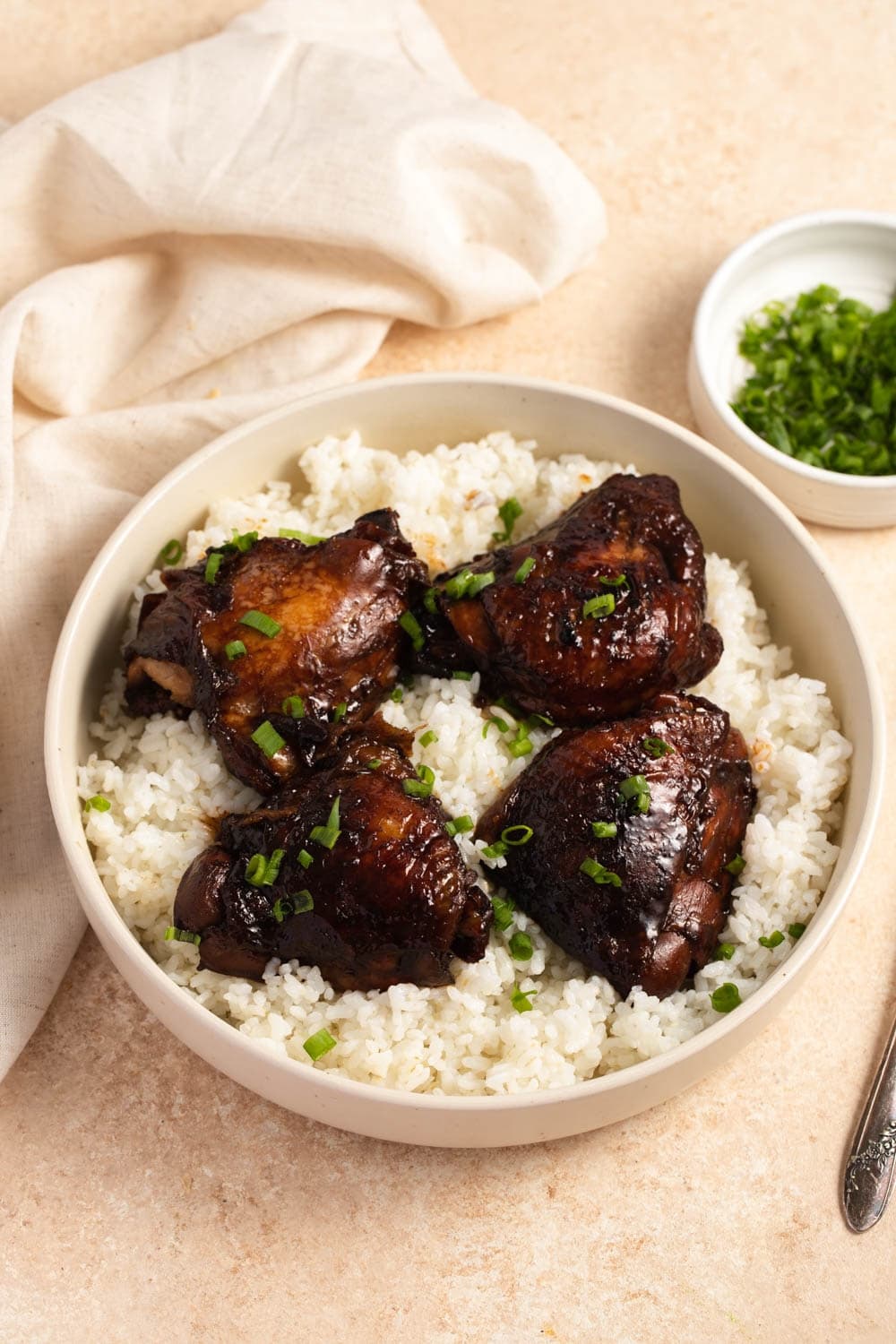 The Best Filipino Chicken Adobo featuring Homemade Filipino Chicken Adobo with Rice and Chopped Onions