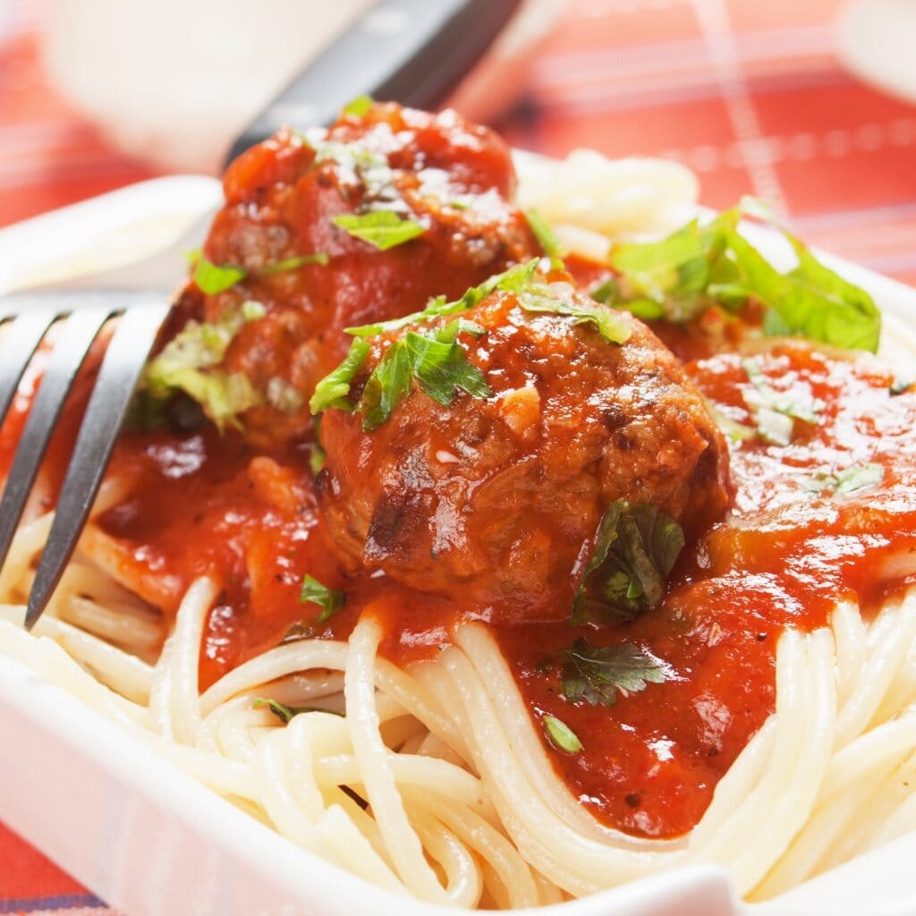 Homemade Spaghetti and Meatballs with Tomato Sauce and Fresh Herbs