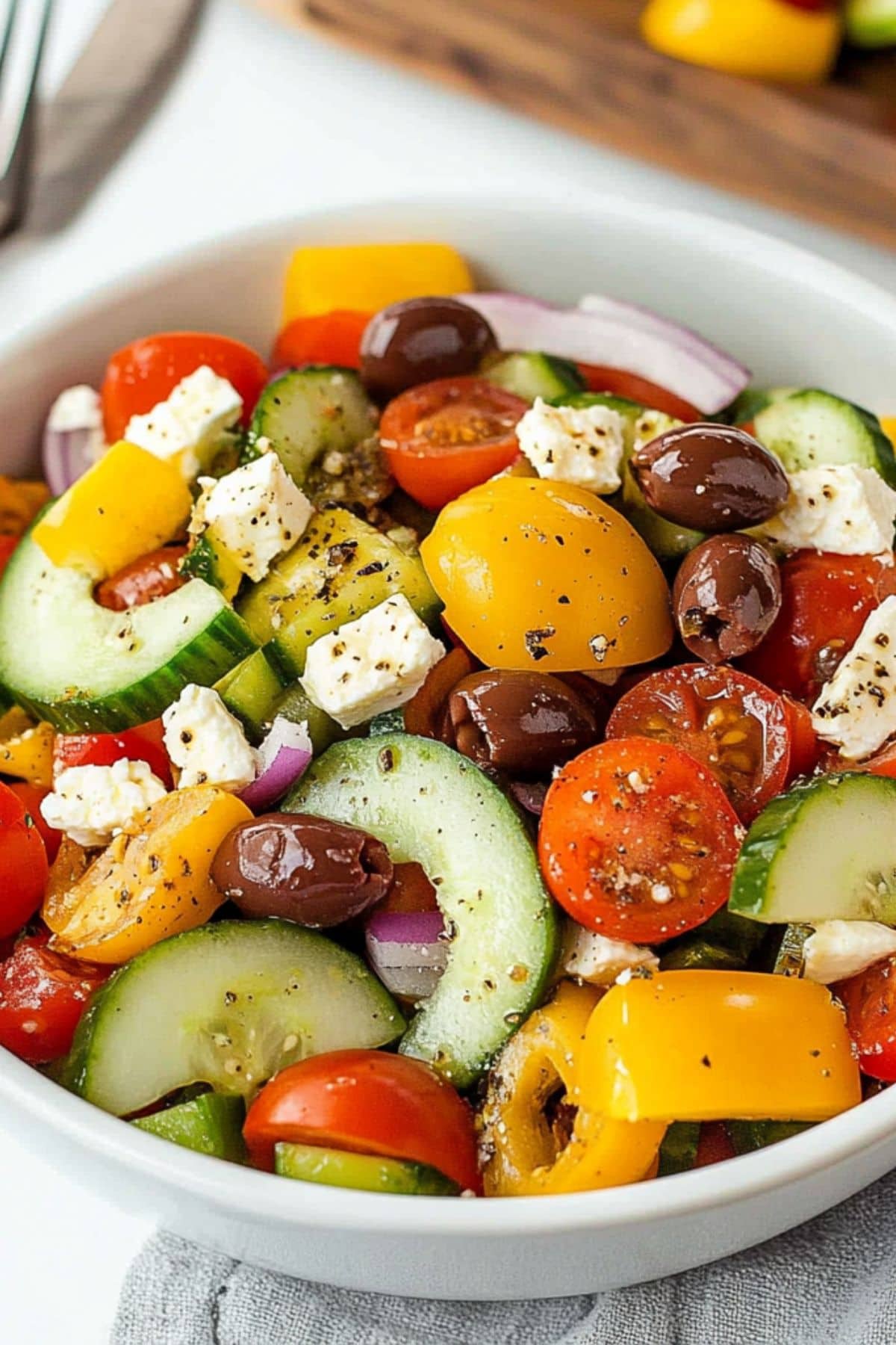 White Bowl With a Serving of Ina Garten Greek Salad.